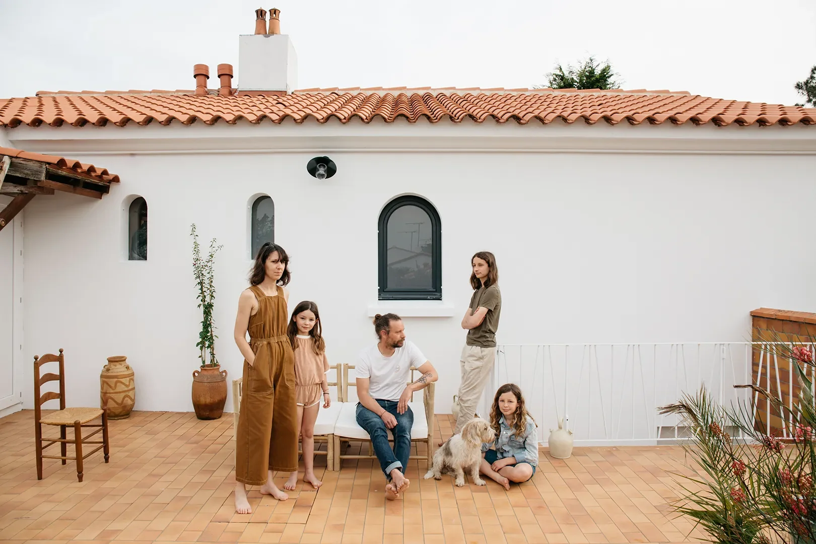 A Plaster Staircase Masquerades as Kitchen Storage in This Serene Seaside French Home