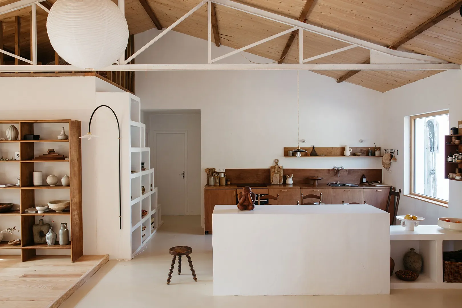 A Plaster Staircase Masquerades as Kitchen Storage in This Serene Seaside French Home