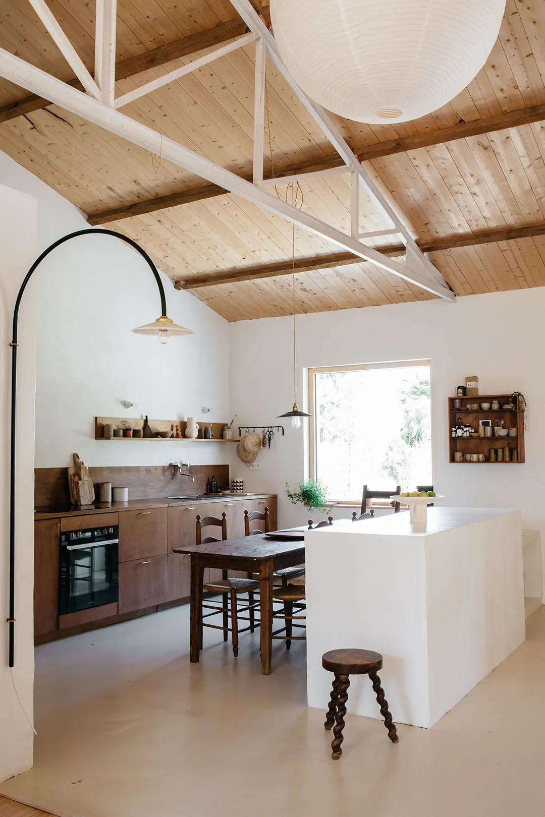 A Plaster Staircase Masquerades as Kitchen Storage in This Serene Seaside French Home