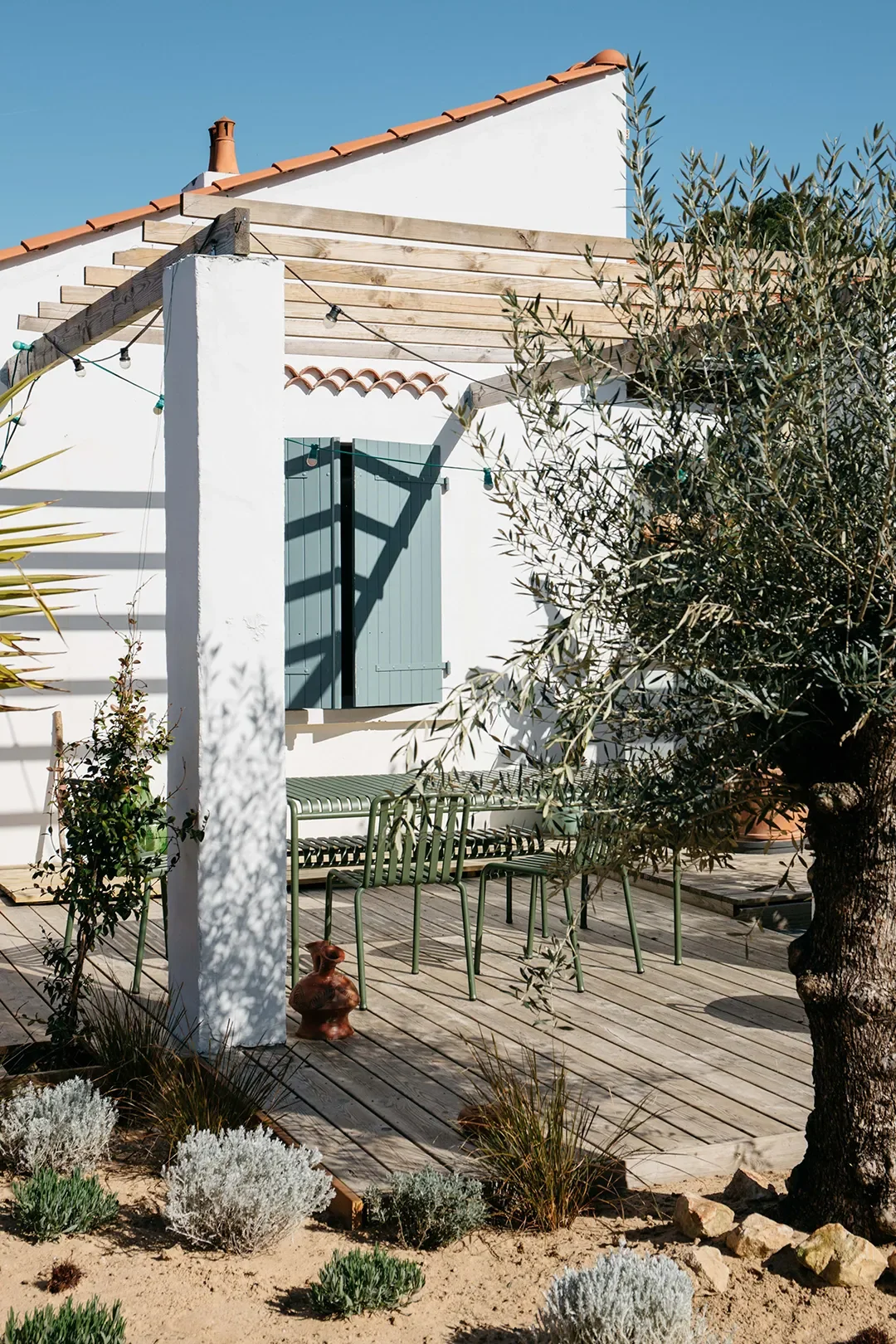 A Plaster Staircase Masquerades as Kitchen Storage in This Serene Seaside French Home