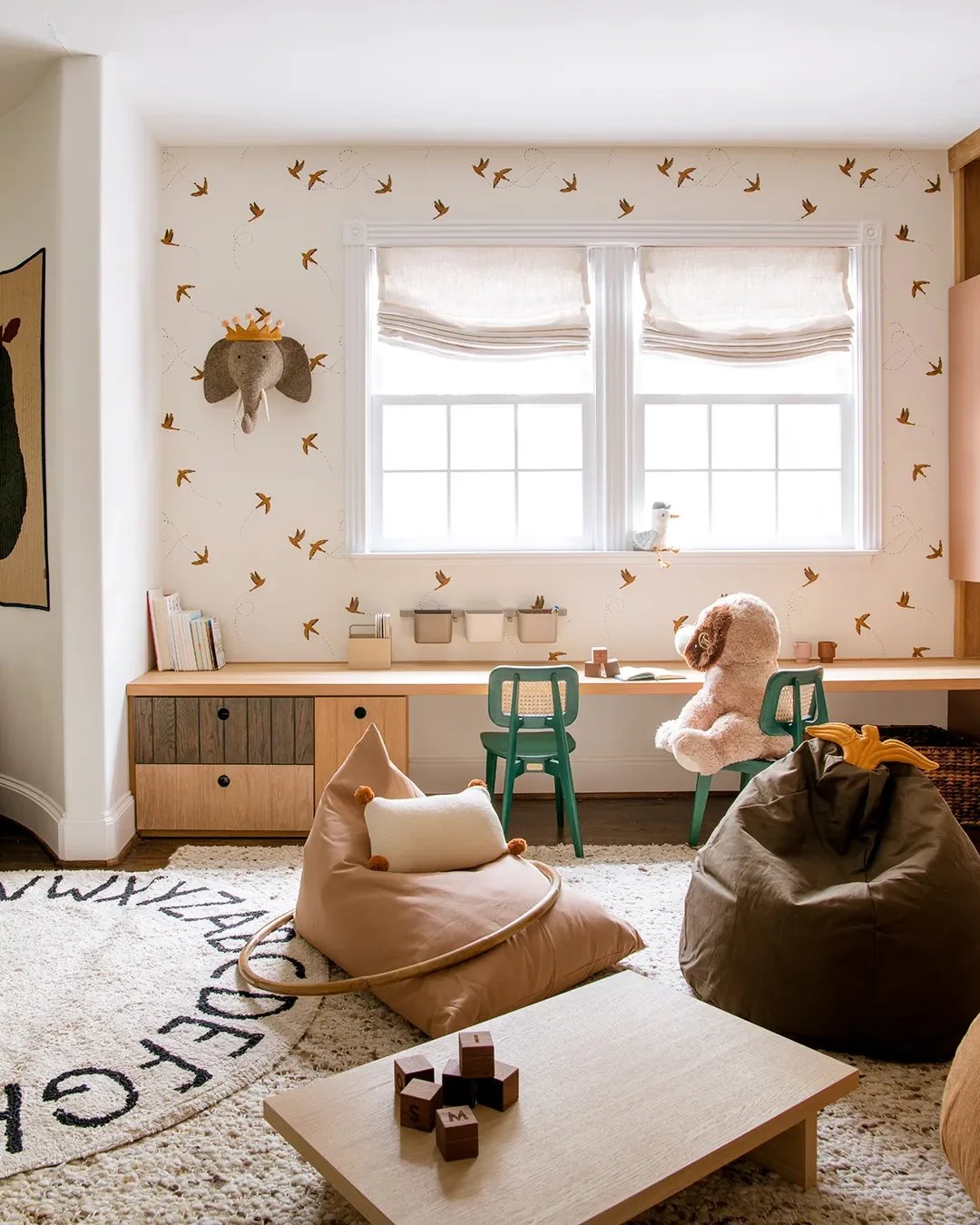 A Wall of Pink Cabinets Turned This Top-of-Stairs Space Into a Chic Playroom