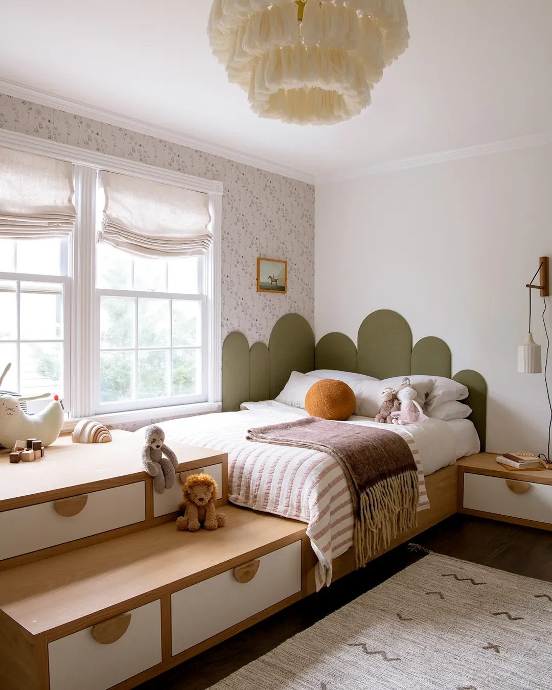 A Wall of Pink Cabinets Turned This Top-of-Stairs Space Into a Chic Playroom