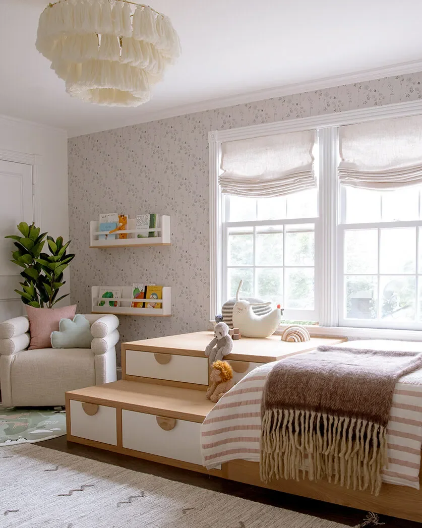 A Wall of Pink Cabinets Turned This Top-of-Stairs Space Into a Chic Playroom