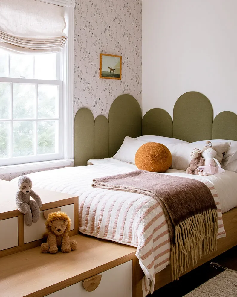 A Wall of Pink Cabinets Turned This Top-of-Stairs Space Into a Chic Playroom