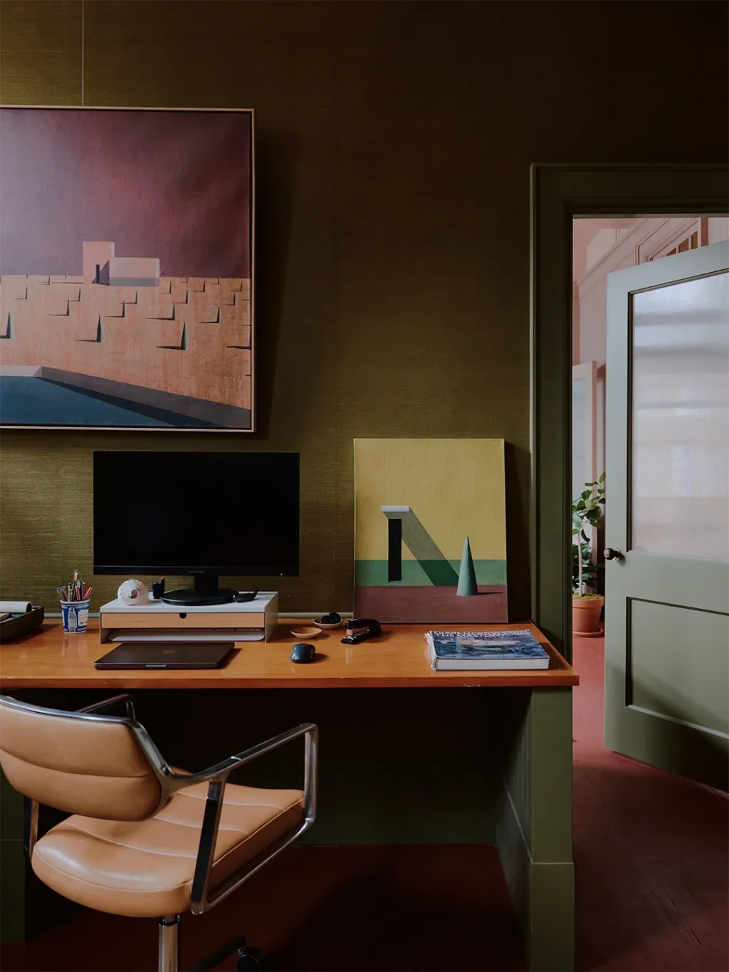 Mismatched Doorknobs and Crimson Floors Give This Design Studio Its Collected Character