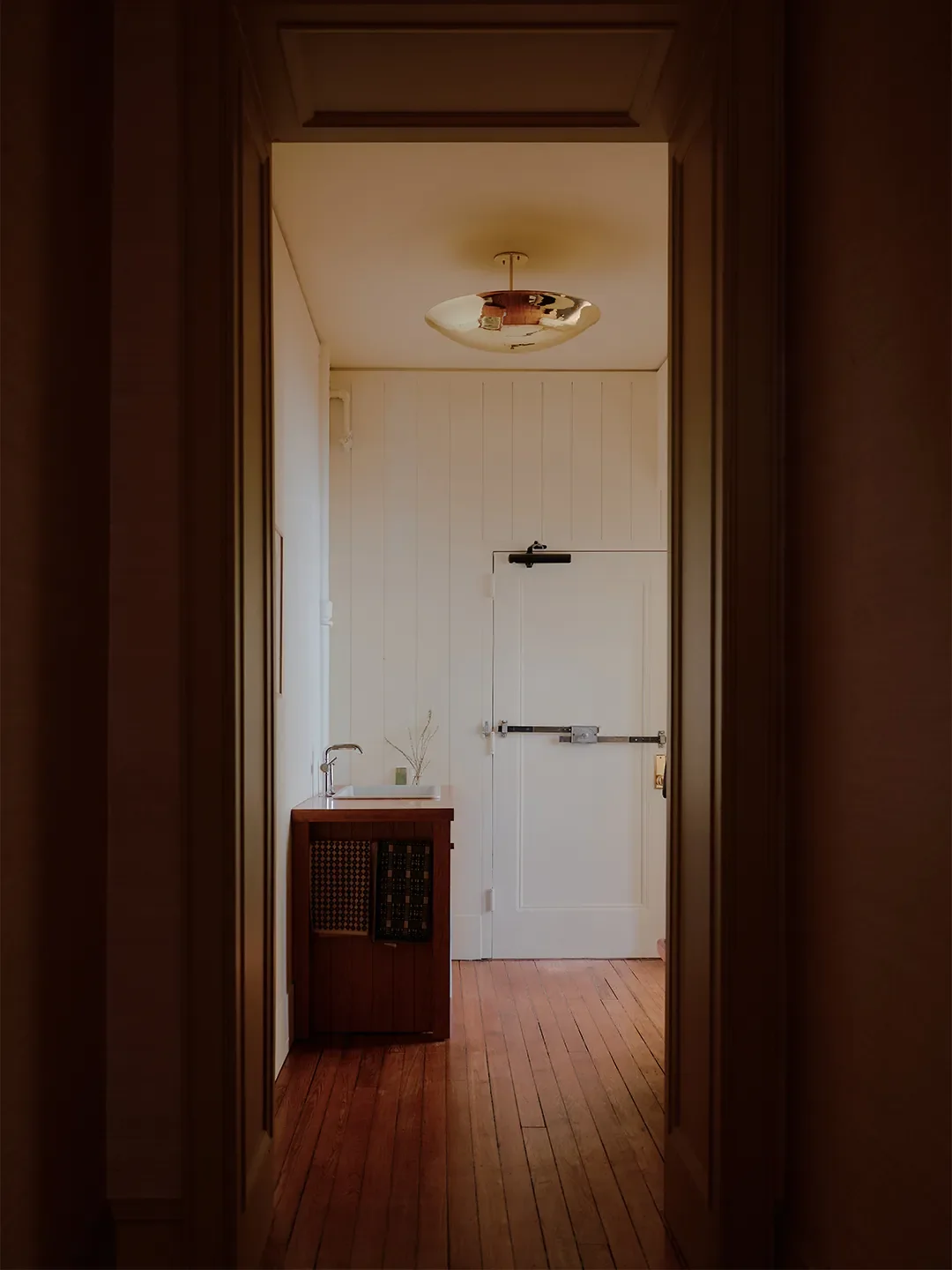 Mismatched Doorknobs and Crimson Floors Give This Design Studio Its Collected Character