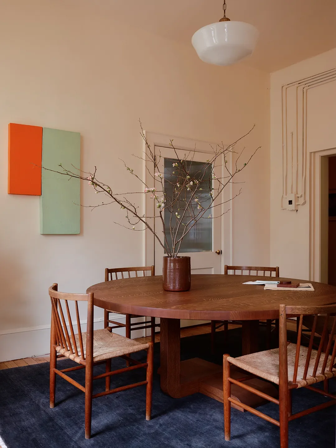 Mismatched Doorknobs and Crimson Floors Give This Design Studio Its Collected Character