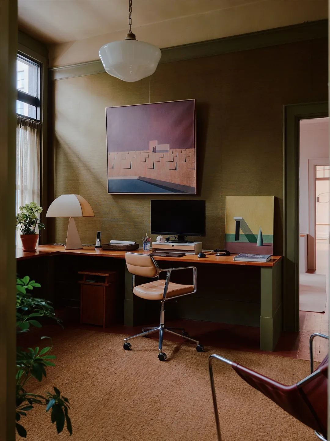 Mismatched Doorknobs and Crimson Floors Give This Design Studio Its Collected Character