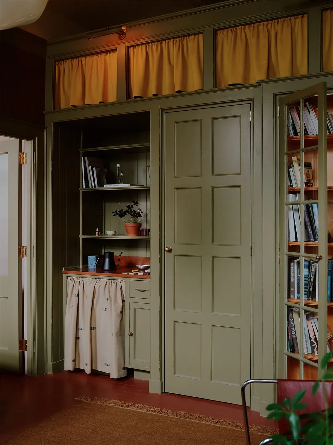 Mismatched Doorknobs and Crimson Floors Give This Design Studio Its Collected Character
